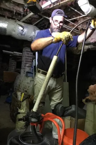 Kevin Tidwell working on a drain line